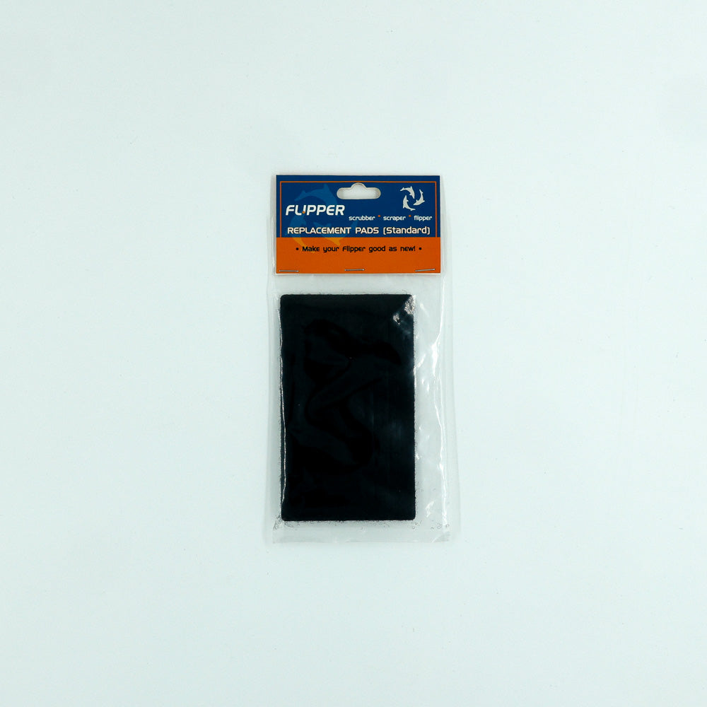 Packaged black replacement pad for Flipper standard on a white background